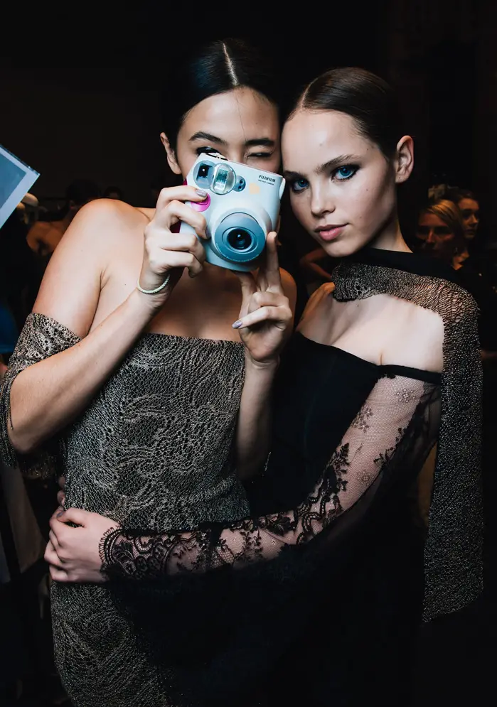 flaunter-3h5JGLWSNLg-unsplash people at a show with nyfw tickets